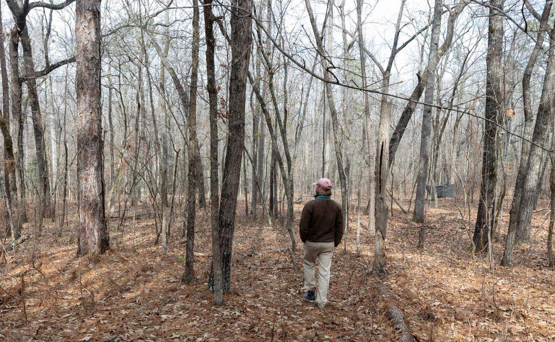 Taylor Brennecke walks on a tract of land near the Sixmile Creek, that has been in his family for multiple generations. The family is in the process of selling about 600 acres that will become an extension of the Congaree Creek Heritage Preserve.