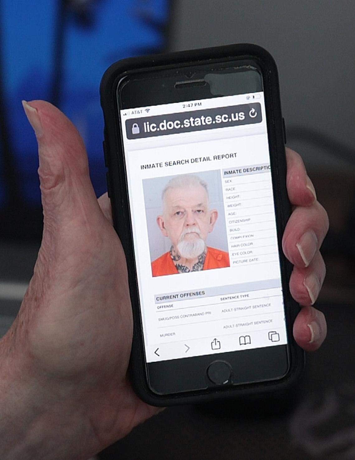 Mack Boulware displays Charles Shirah's status on his phone.