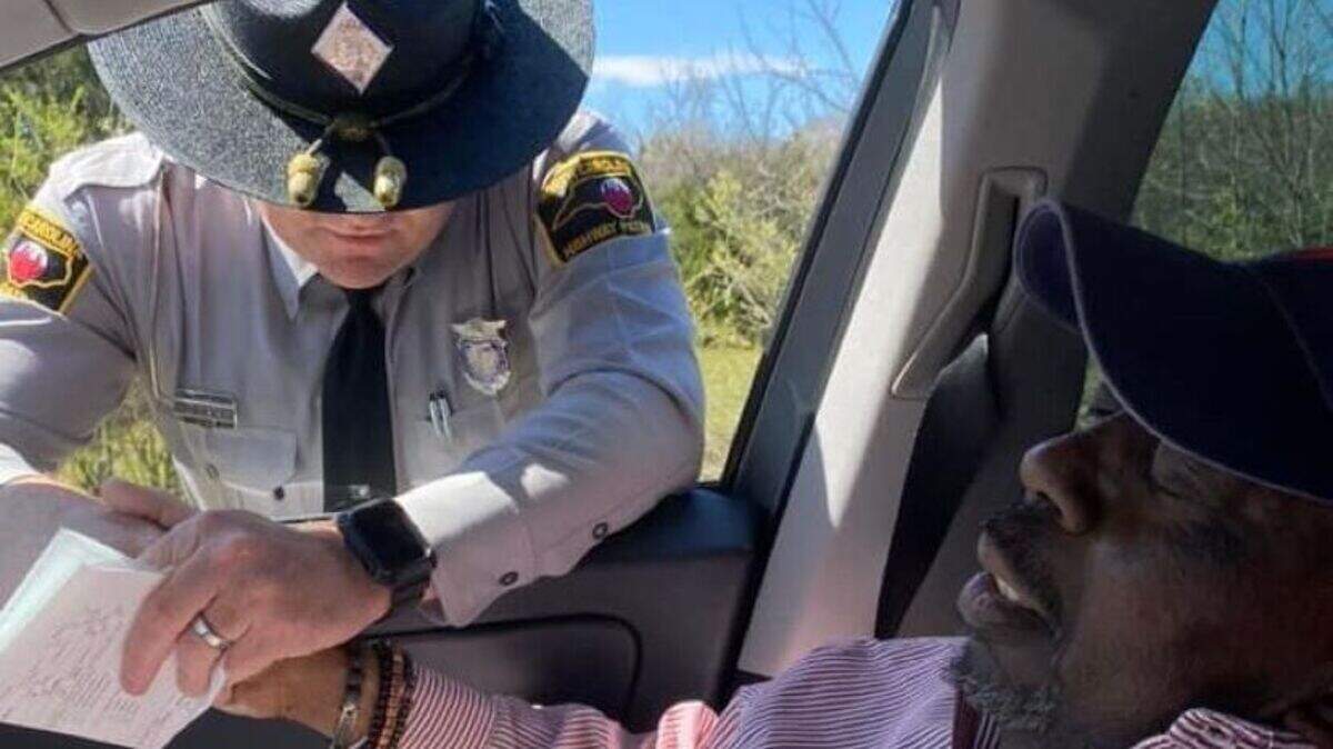 State Trooper Doty and Geddis joining in prayer