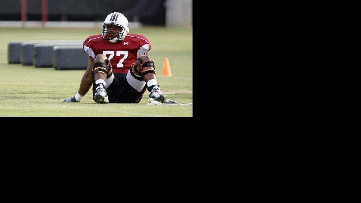 Senior USC offensive tackle Garrett Chisolm waits for practice to start Aug. 5, 2010, at the Proving Grounds. 