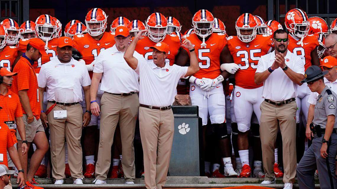 Clemson head coach Dabo Swinney waves to the crowd as he prepares to led his team onto the field for an NCAA college football game against Georgia Tech Saturday, Sept. 18, 2021, in Clemson, S.C. (AP Photo/John Bazemore)