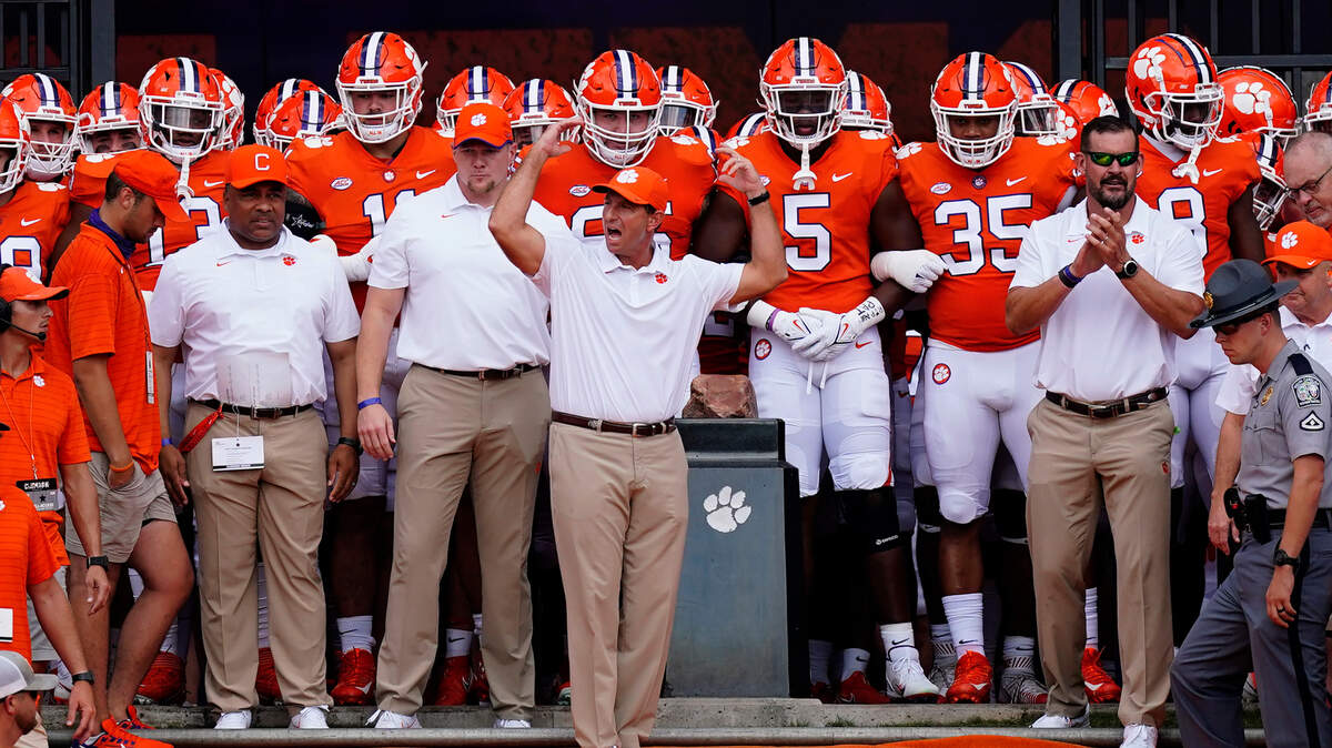 Clemson head coach Dabo Swinney waves to the crowd as he prepares to led his team onto the field for an NCAA college football game against Georgia Tech Saturday, Sept. 18, 2021, in Clemson, S.C. (AP Photo/John Bazemore)