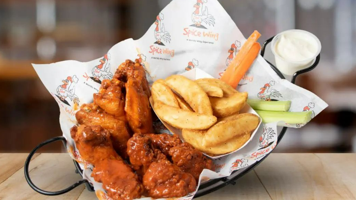 A plate of chicken and fries from Spice Wing.