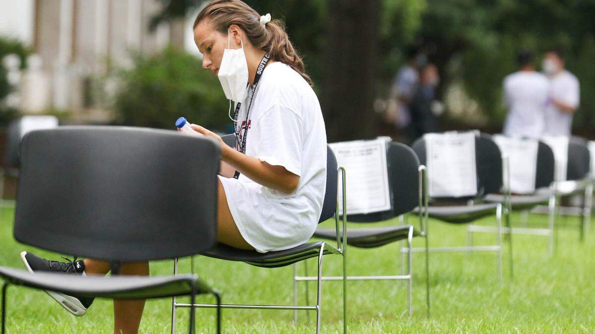 USC student Demetria Radgio prepares to take a saliva based COVID-19 test being administered on campus. The University of South Carolina is encouraging weekly tests to help control the spread of the coronavirus. Results from the test take less than 24 hours. 8/19/20