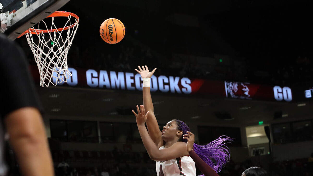 South Carolina’s Aliyah Boston (4) shoots as Mississippi State’s Danae Carter (25) defends during the second half of action on Sunday, Jan. 2, 2022 in the Colonial Life Arena.