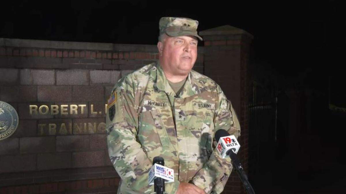 U.S. National Guard Major General Van McCarty speaks at a news conference.