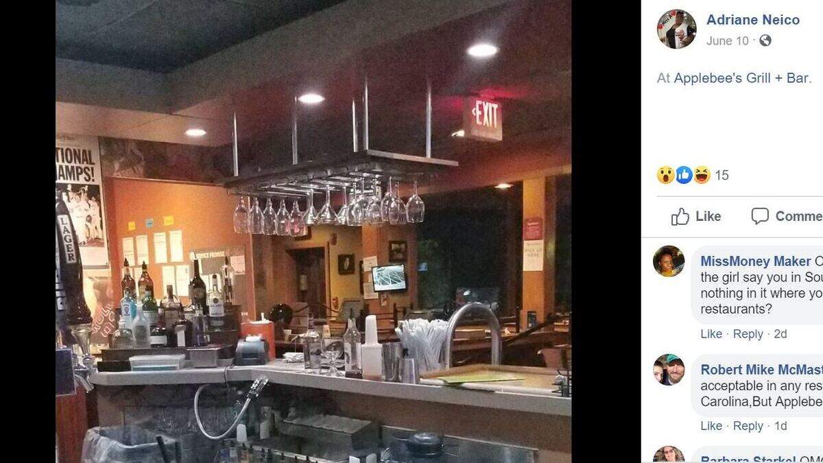 Adriane Neico posted photos and video of the opossum as it explored under the bar.