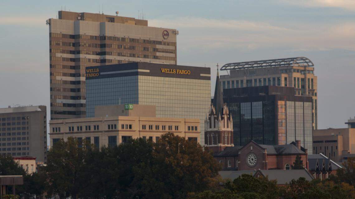 The downtown Columbia skyline shines beyond the fountain at Finlay Park on Thursday, Nov. 20, 2025.