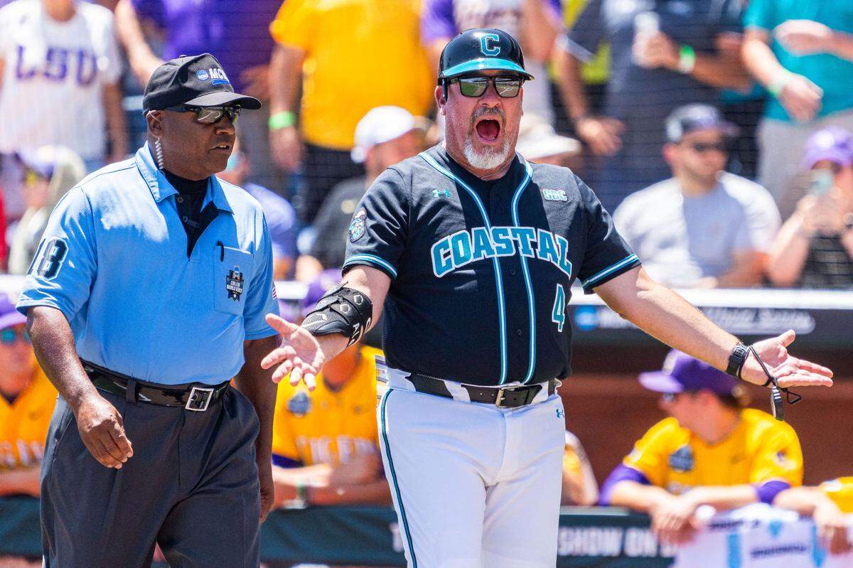 Coastal Carolina Chanticleers assistant coach Matt Schilling reacts after being ejected during the first inning Sunday against the LSU Tigers at Charles Schwab Field.