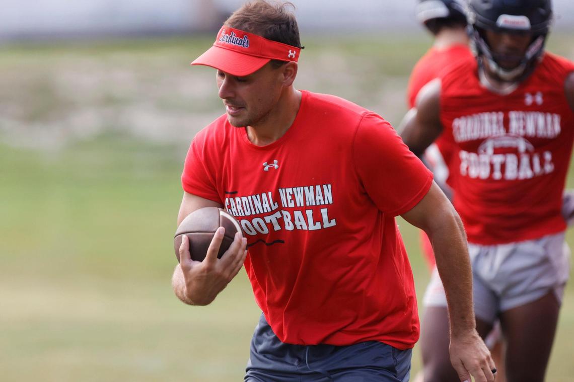 Cardinal Newman Coach Perry Ortth instructs his team as they practice football on Friday, July 28, 2023.