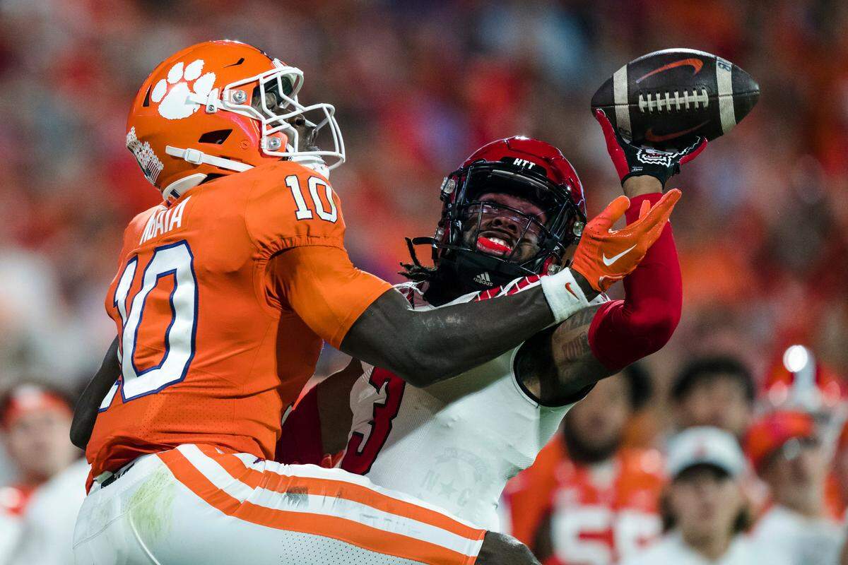 North Carolina State cornerback Aydan White (3) knocks the ball away from Clemson wide receiver Joseph Ngata (10) in the first half of an NCAA college football game, Saturday, Oct. 1, 2022, in Clemson, S.C. (AP Photo/Jacob Kupferman)