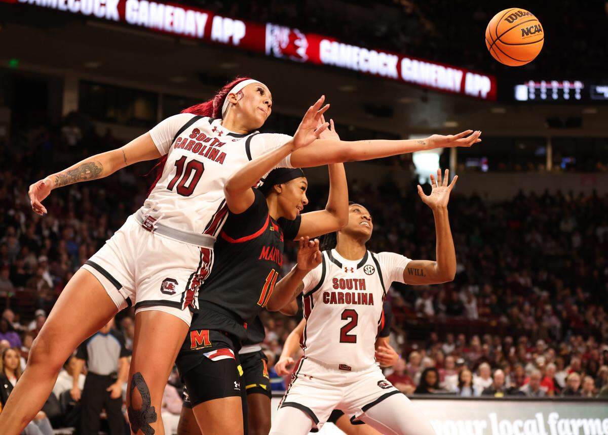 South Carolina center Kamilla Cardoso (10) and forward Ashlyn Watkins (2) go for a loose ball with Maryland guard Jakia Brown-Turner (11) during the first half of the Gamecocks’ game against the visiting Terrapins at Colonial Life Arena on Sunday, November 12, 2023.