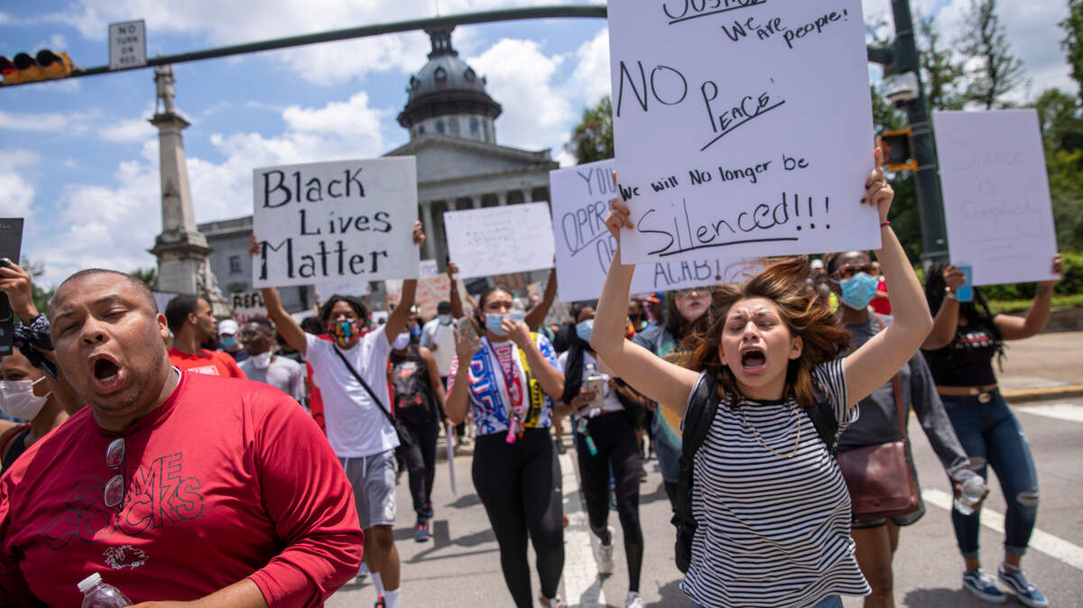 Protesters move up Main Street as they march the streets of Columbia, S.C. on May 31, 2020