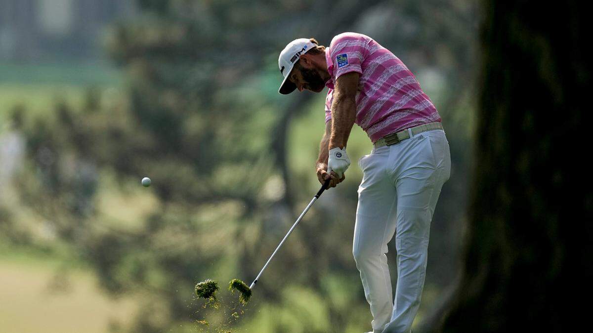Dustin Johnson hits on the first fairway during the first round of the Masters golf tournament on Thursday, April 8, 2021, in Augusta, Ga.