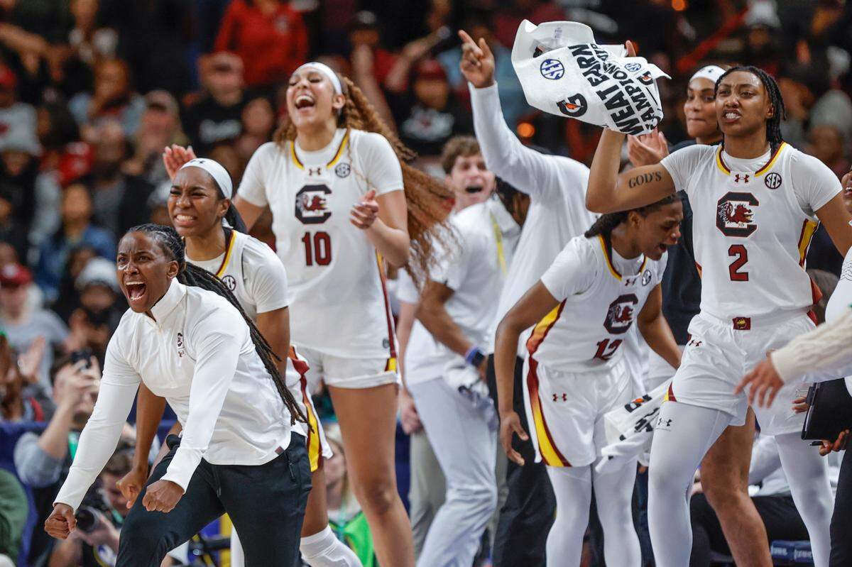South Carolina assistant coach Khadijah Sessions and the Gamecocks react from the bench during the first half of action in the SEC Tournament against Tennessee at the Bon Secours Wellness Arena in Greenville on Saturday, March 9, 2024