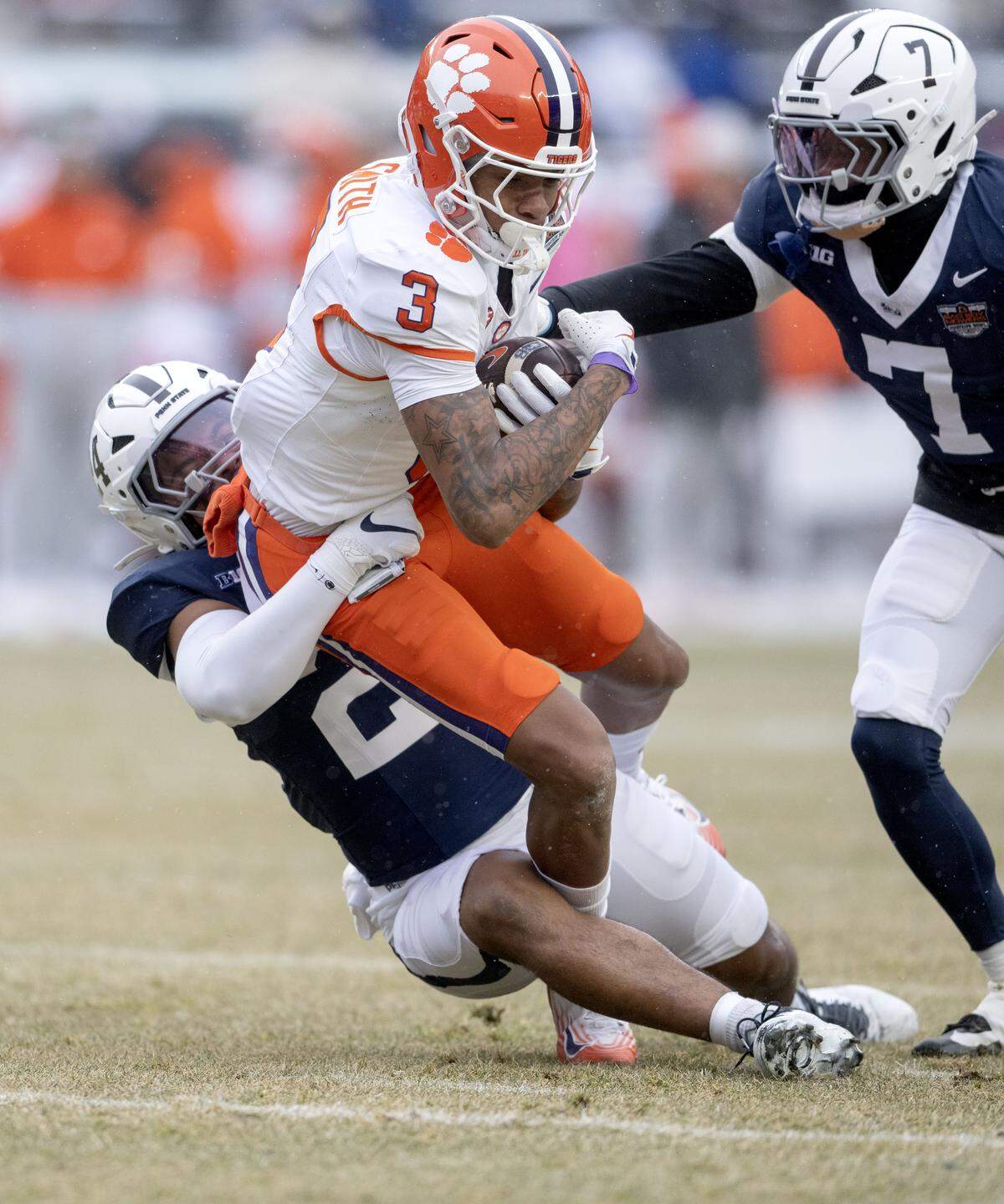 Clemson wide receiver Tristan Smith is tripped up by Penn State linebacker Amare Campbell during the Pinstripe Bowl at Yankee Stadium on Saturday, Dec. 27, 2025.
