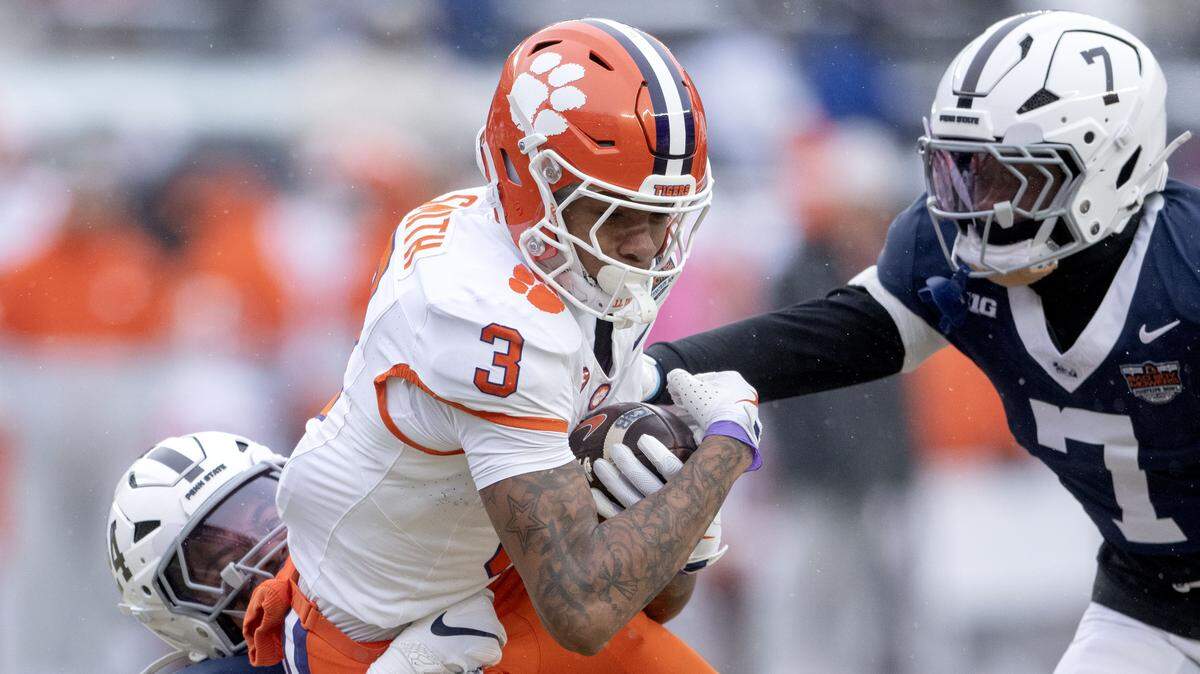 Clemson wide receiver Tristan Smith is tripped up by Penn State linebacker Amare Campbell during the Pinstripe Bowl at Yankee Stadium on Saturday, Dec. 27, 2025.