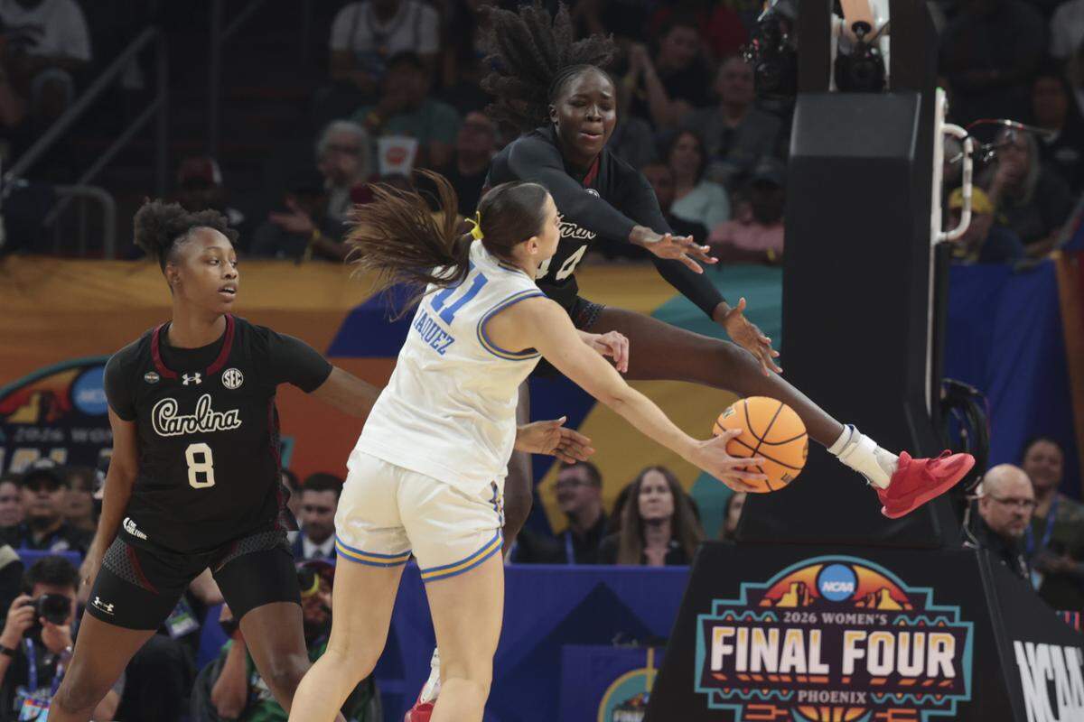 South Carolina's Agot Makeer (44) pressures UCLA’s Gabriela Jaquez (11) during the first half of action of their women's basketball game for the NCAA national championship against UCLA at Mortgage Matchup Center in Phoenix on Sunday, April 5,2026.
