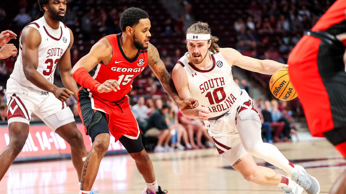 South Carolina Gamecocks forward Hayden Brown (10) drives around Georgia Bulldogs forward Jailyn Ingram (15) in the first half at Colonial Life Arena.