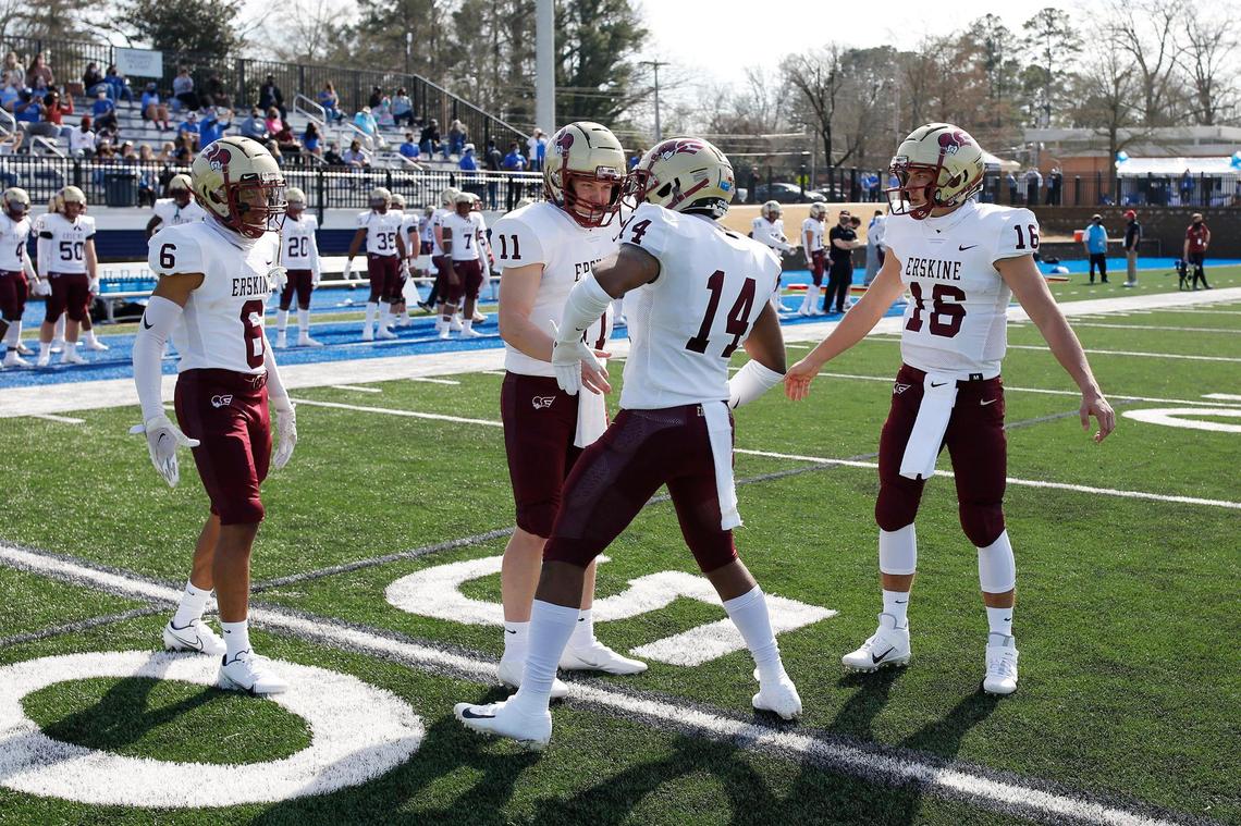 Erskine linebacker Brandon Lane (14) and quarterback Craig Pender (11) get hyped before the game Saturday against Barton.