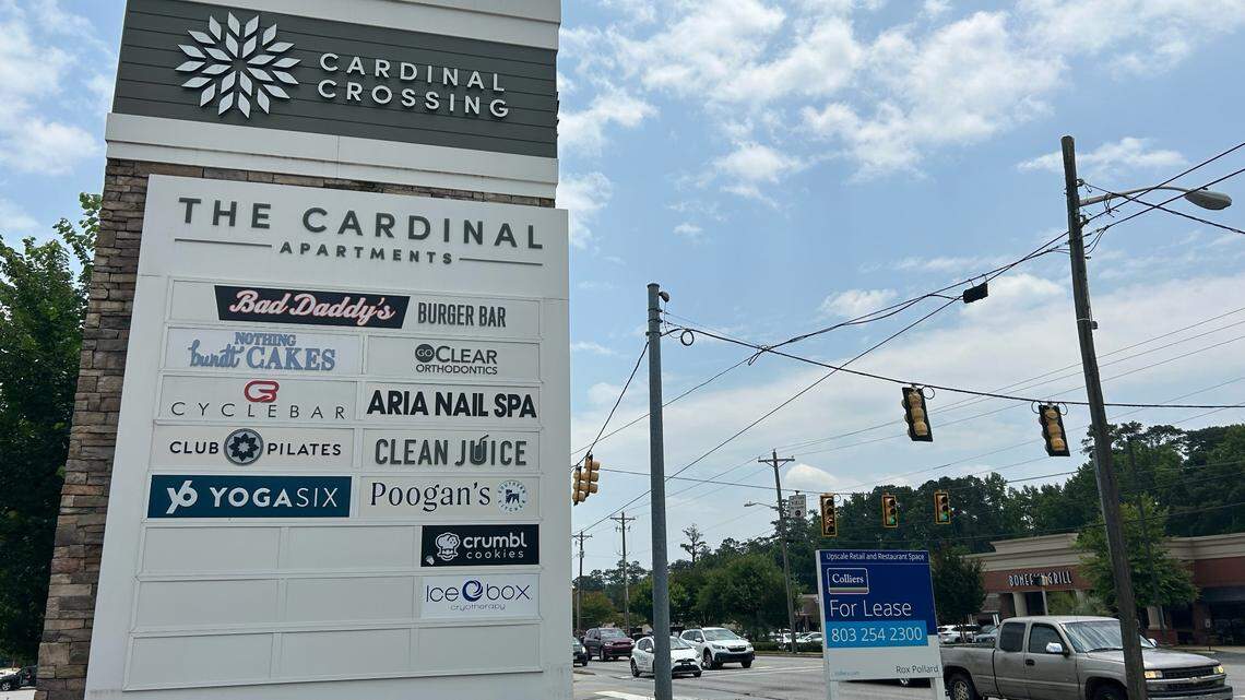 The sign for Cardinal Crossing, a mixed-use development on the site of the former Cardinal Newman School on Forest Drive.