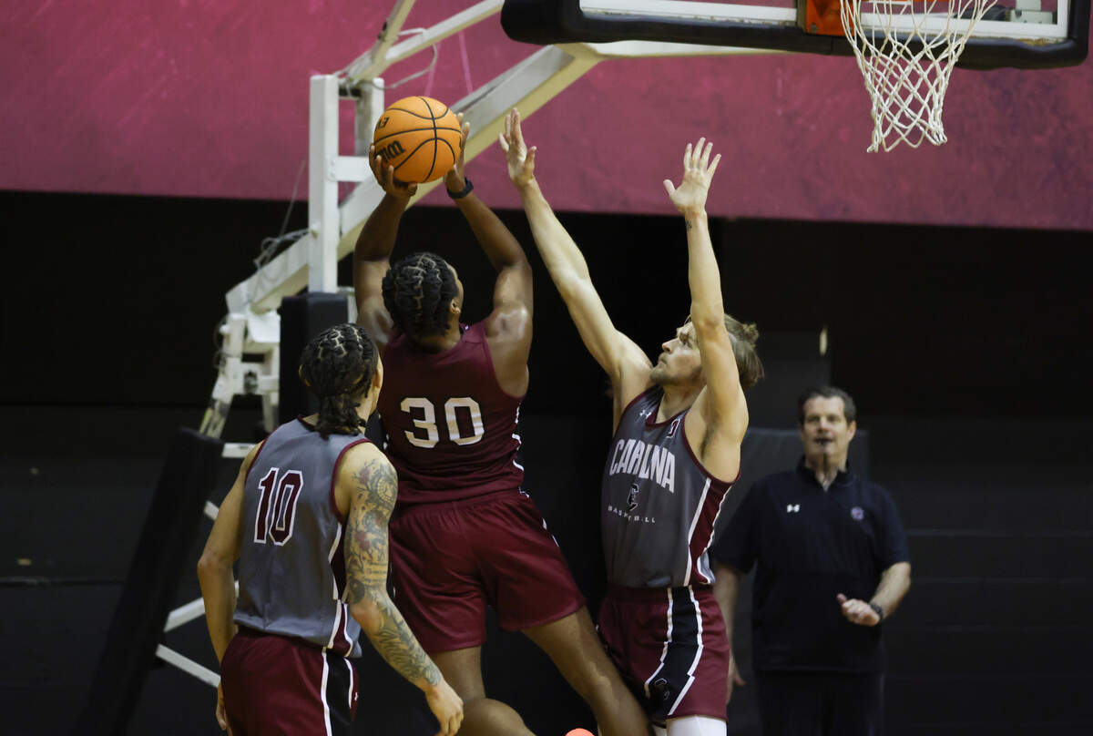 Gamecock Collin Murray-Boyles (30) puts up a shot over Stephen Clark (0) during practice at Carolina Coliseum in Columbia on Wednesday, August 2, 2023.
