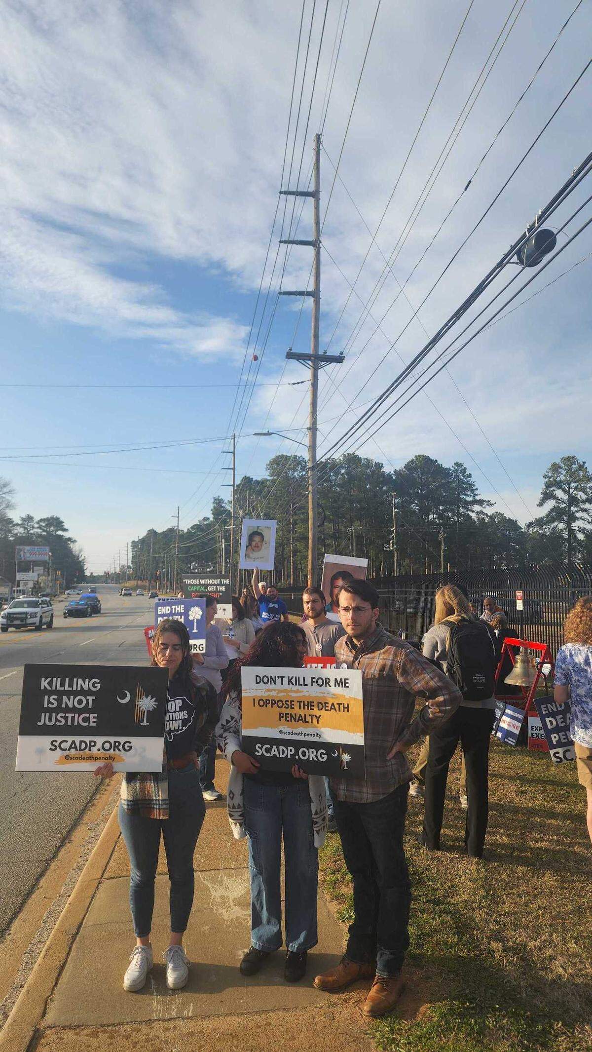 Nearly 30 protests stand in protest of the execution of Brad Sigmon in front of the Broad River Correctional Institution on Friday, March 7, 2025.