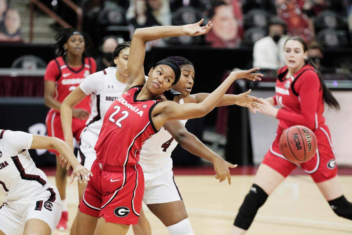 Georgia Lady Bulldogs forward Malury Bates (22) and South Carolina Gamecocks forward Aliyah Boston (4) attempt to recover the ball at Colonial Life Arena on Thursday, January 21, 2021.