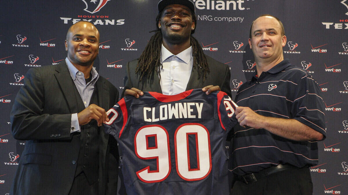 Houston Texans general manager Rick Smith (left) and head coach Bill O’Brien (right) pose for a picture with first-round draft pick Jadeveon Clowney (middle) during a press conference at Reliant Stadium. Drafted in 2014, Clowney now plays for the Cleveland Browns.