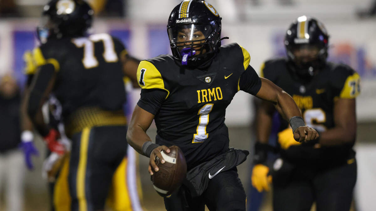 Aaron Brand Jr. (1) of Irmo looks to pass during the Class 5A-D2 football state championship game at Oliver Dawson Stadium in Orangeburg on Saturday, December 14, 2024.