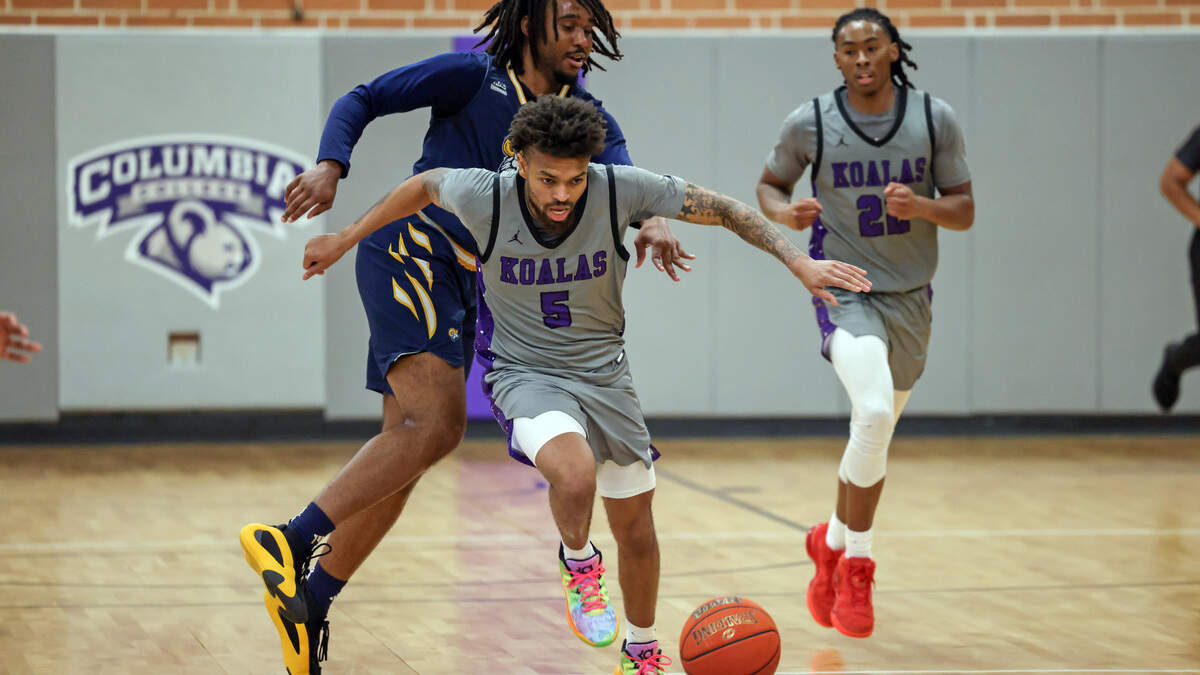 Tae Burton (5) of Columbia College drives past Christian Howard (13) of Columbia International University defends during the Koalas’ game against Columbia International University at Godbold Gym in Columbia on Feb. 12.