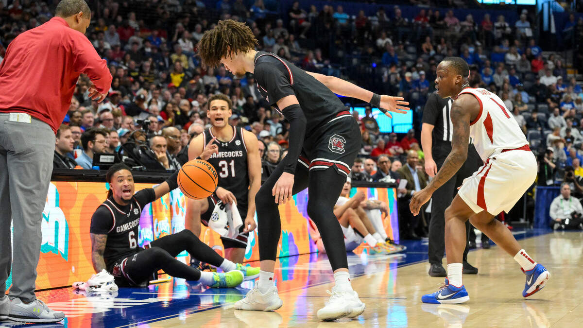 South Carolina Gamecocks guard Jamarii Thomas (6) and forward Benjamin Bosmans-Verdonk (31) reacts after the steal made by forward Jordan Butler (0) on Arkansas Razorbacks guard Johnell Davis (1) during the first half at Bridgestone Arena.