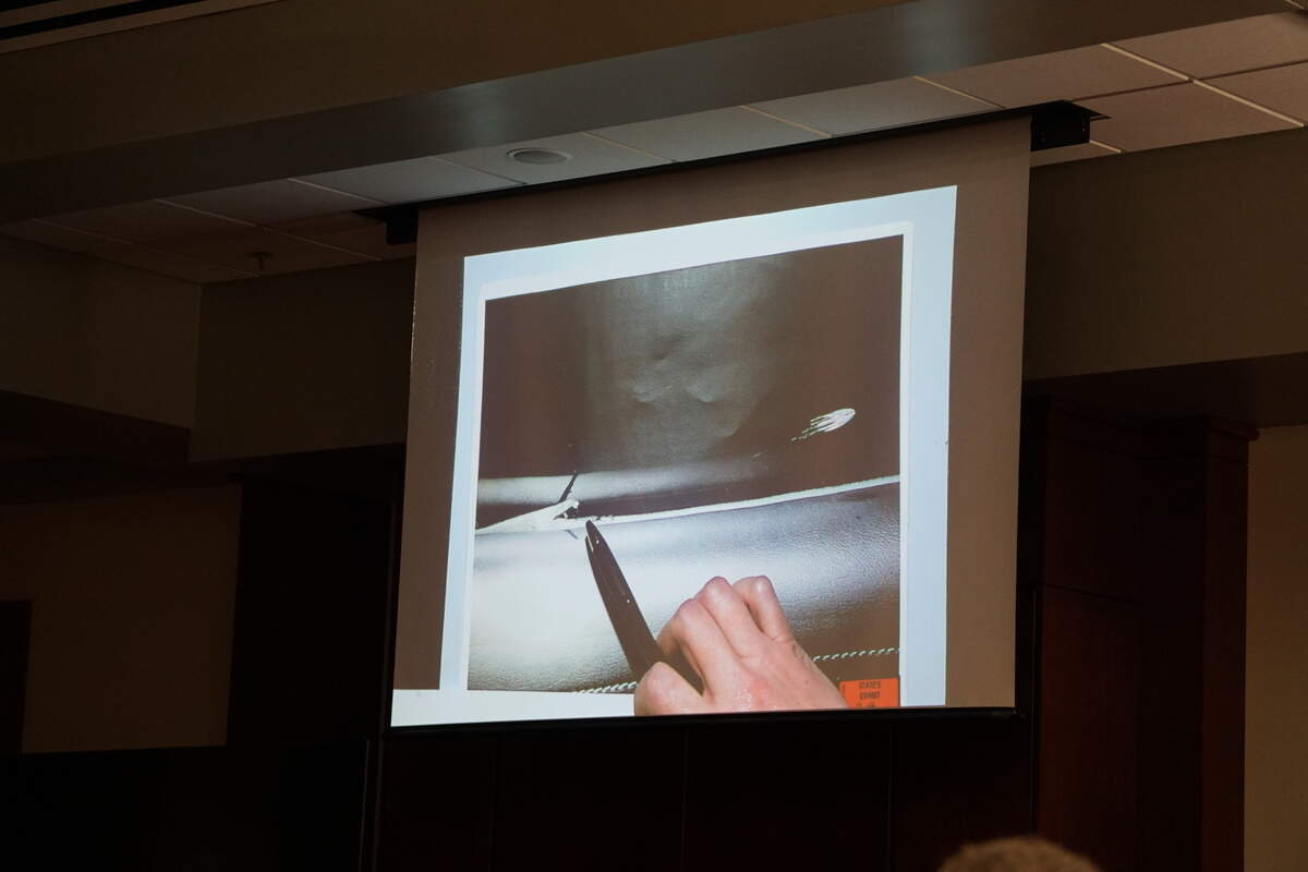During testimony at the Lexington County Courthouse, investigator Jamie Johnson uses an overhead projector to show how a bullet ricocheted off of a truck window and lodged in the door on July 5, 2023