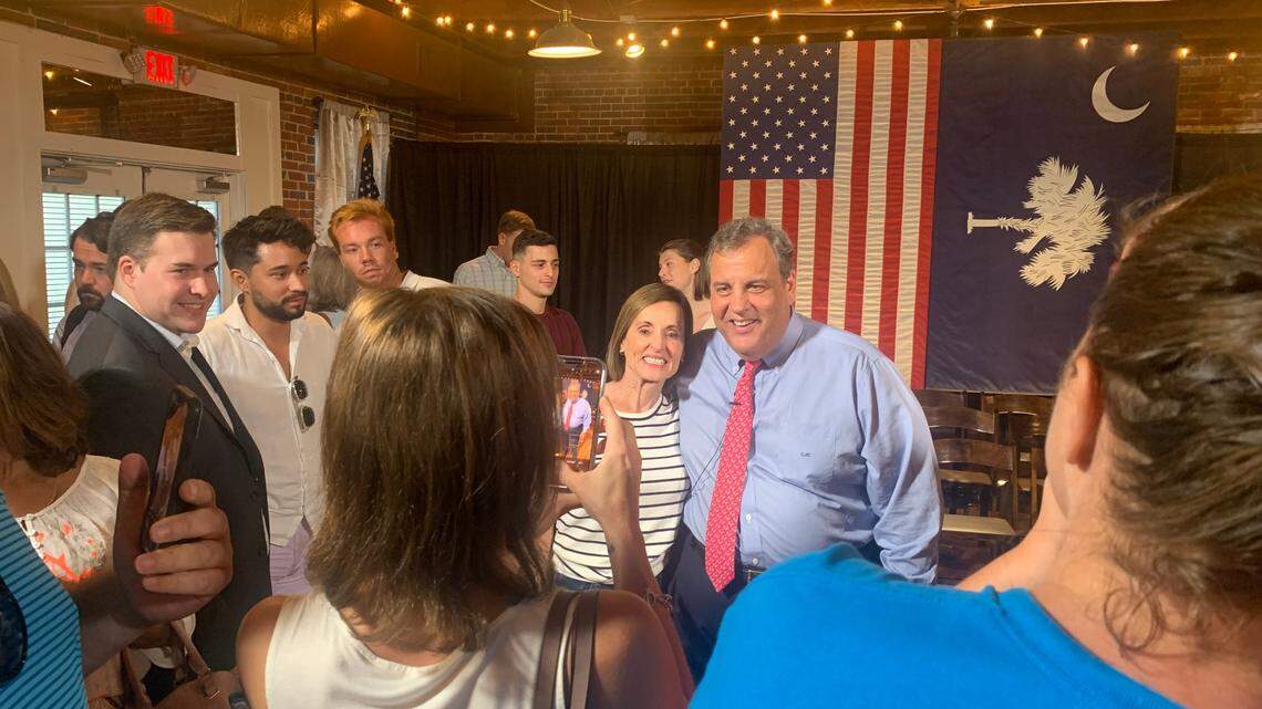 Former New Jersey Gov. Chris Christie takes photos with town hall attendees on Friday, July 21, 2023 at Senate’s End in Columbia, S.C.