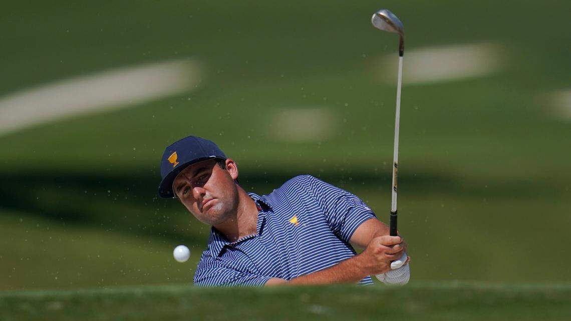 Scottie Scheffler chips to the fifth green during practice for the Presidents Cup golf tournament at the Quail Hollow Club, Wednesday, Sept. 21, 2022, in Charlotte, N.C. (AP Photo/Julio Cortez)