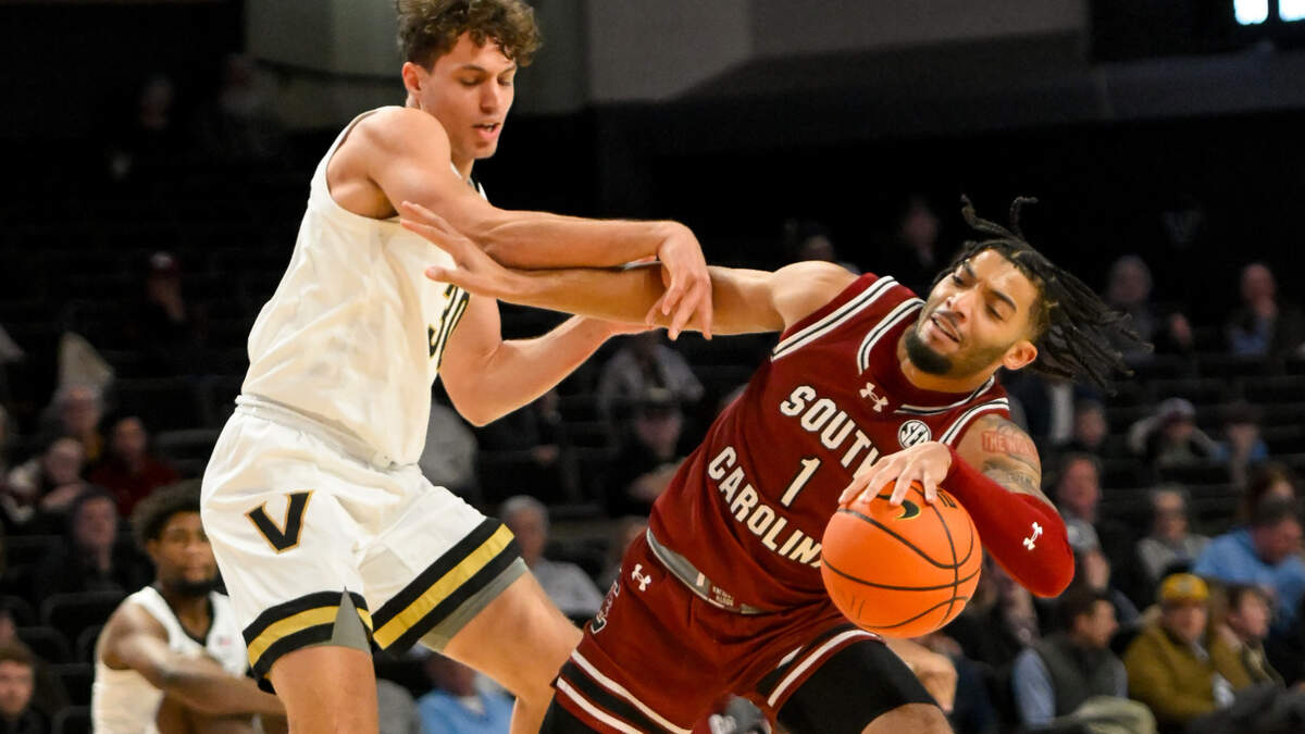 Vanderbilt Commodores guard Chris Manon (30) and South Carolina Gamecocks guard Jacobi Wright (1) fight for the ball during the first half at Memorial Gymnasium.