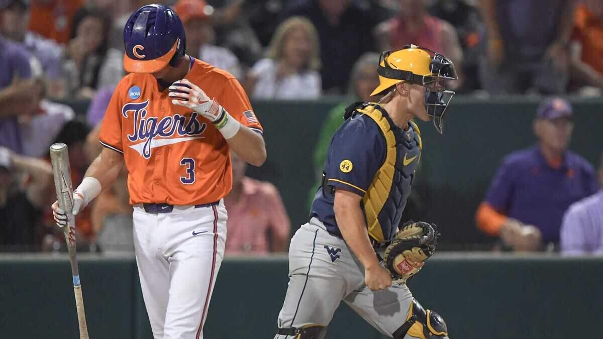 Clemson outfielder Jack Crighton (3) strikes out near West Virginia junior Logan Sauve (33) to end the NCAA baseball Clemson Regional game with West Virginia at Doug Kingsmore Stadium in Clemson, S.C. Saturday, May 31, 2025. West Virginia won 9-6.