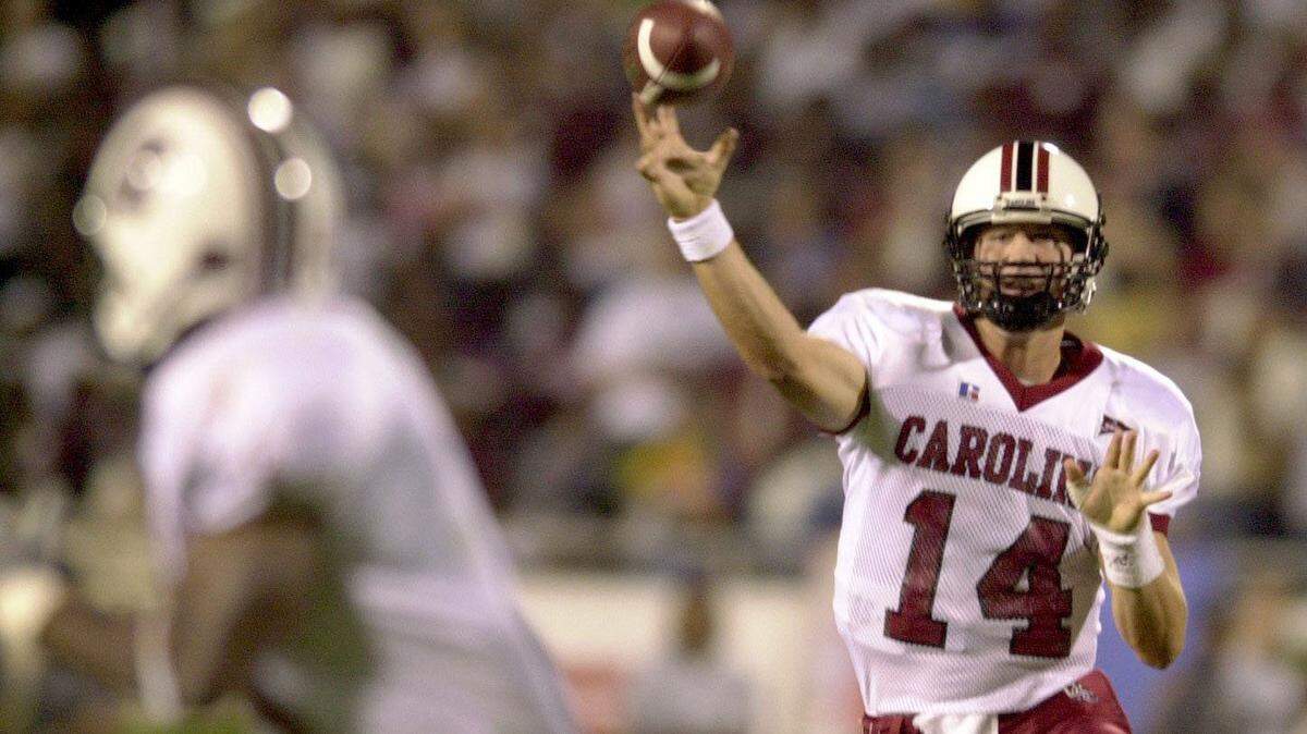 Sept. 20, 2001: USC quarterback Phil Petty looks for an open receiver.