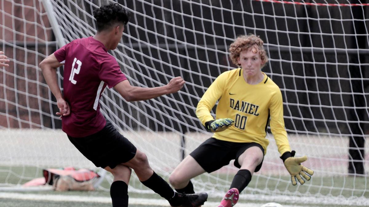Brookland-Cayce’s Eduardo Moisa Membreno 12 scores as Daniel’s Branton Huss 00 fails to block at Irmo High School on Saturday, May 15, 2021.