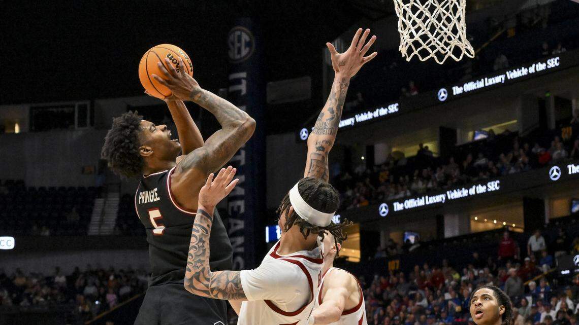 South Carolina Gamecocks forward Nick Pringle (5) lays the ball in over Arkansas Razorbacks forward Trevon Brazile (4) during the second half at Bridgestone Arena.