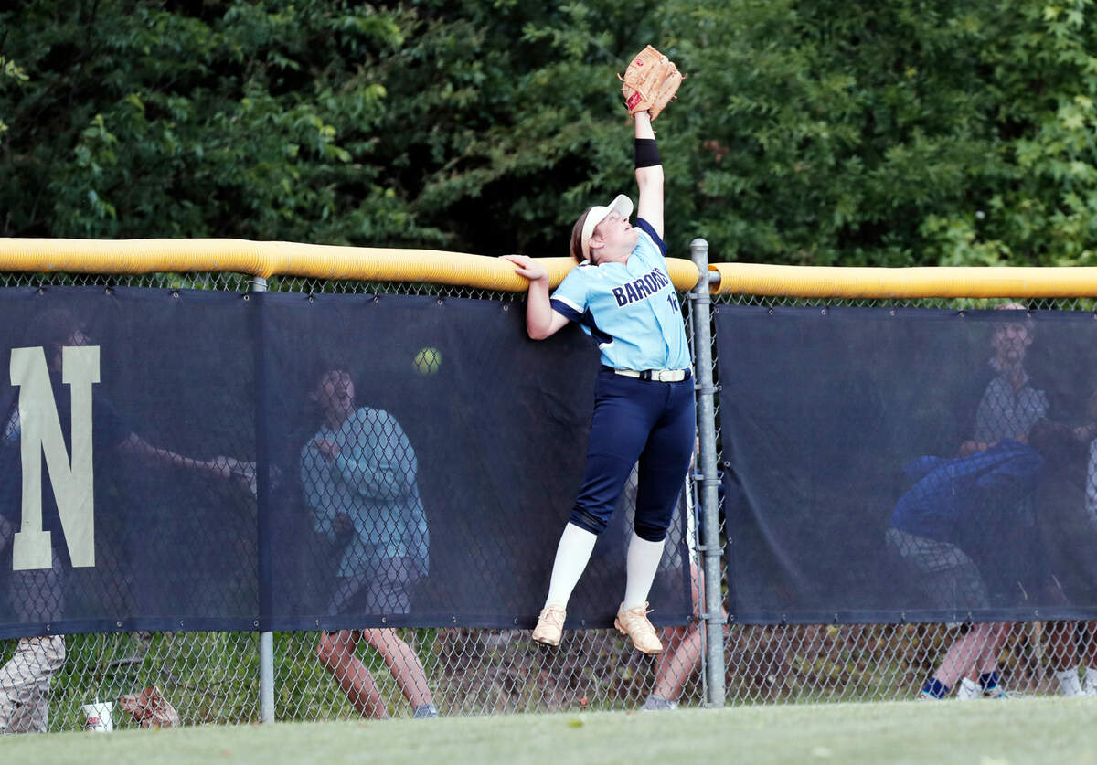 Wilson Hall’s Sully Jarecki jumps to try and catch a Cardinal Newman home run ball in the deciding game of the SCISA 3A championship at Camden High School on Thursday, May 13, 2021.