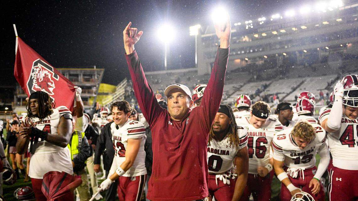 South Carolina Gamecocks head coach Shane Beamer and his team celebrate the win with their fans against the Vanderbilt Commodores during the second half at FirstBank Stadium.