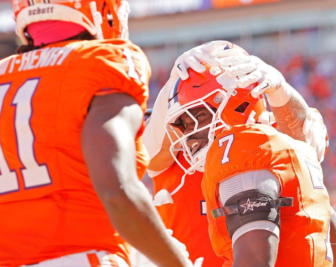 Clemson running back Phil Mafah (7) is congratulated after scoring a touchdown against Virginia during first-half action in Clemson, S.C. on Saturday, Oct. 19, 2024.