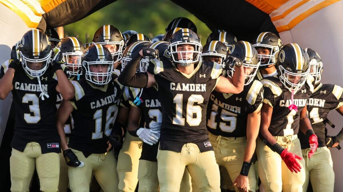 Camden Bulldogs players prepare to enter the field before the game against the Gray Collegiate War Eagles.