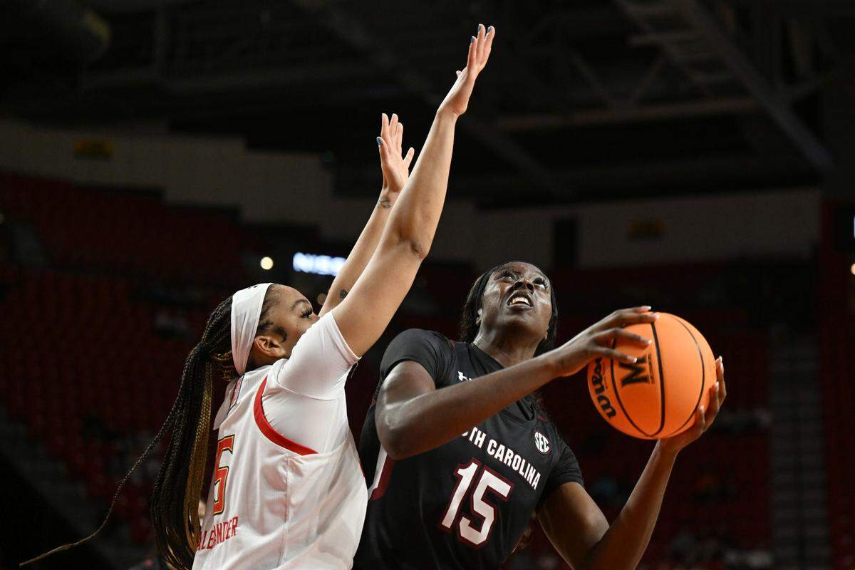 South Carolina’s Laeticia Amihere looks to shoot as Maryland’s Brinae Alexander defends during the first half of an NCAA college basketball game Friday, Nov. 11, 2022, in College Park, Md. (AP Photo/Gail Burton)