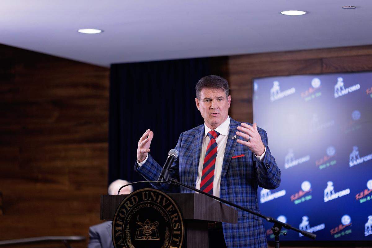 Former Clemson football senior offensive analyst and Jacksonville State coach John Grass was introduced as the new coach at FCS Samford on Dec. 3, 2025.