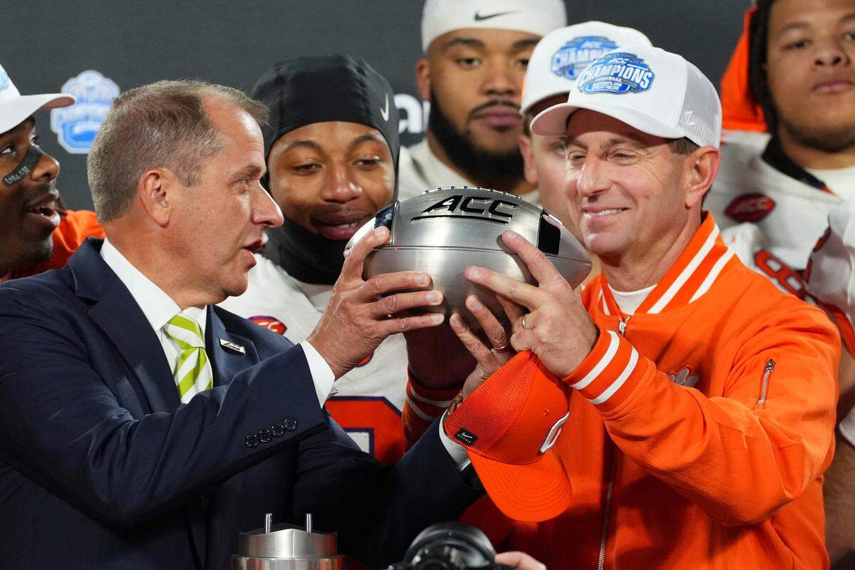 Dabo Swinney of the Clemson Tigers accepts the trophy after winning the 2024 ACC Football Championship at Bank of America Stadium on December 07, 2024 in Charlotte, North Carolina.