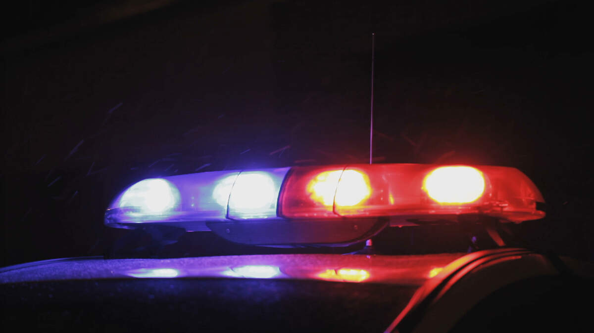 Stock image of police lights at night.