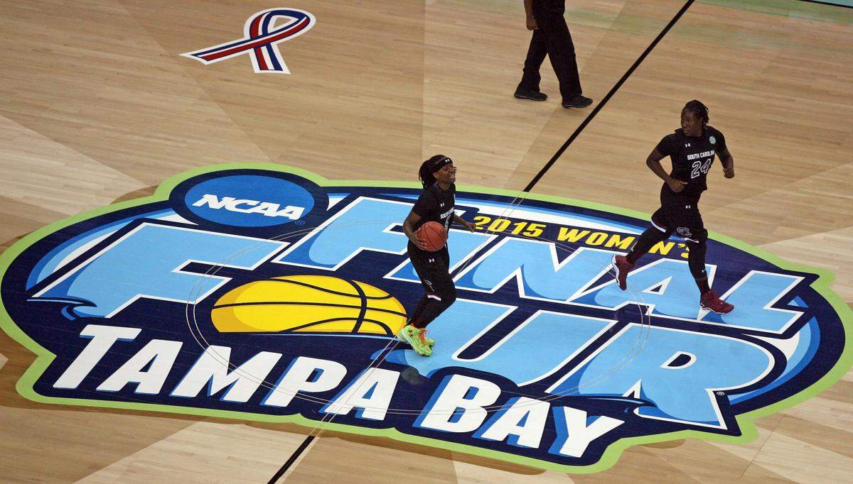 South Carolina's Khadijah Sessions and Aleighsa Welch advance the ball against Notre Dame in their Final Four game at Amalie Arena in Tampa on April 5, 2015.
