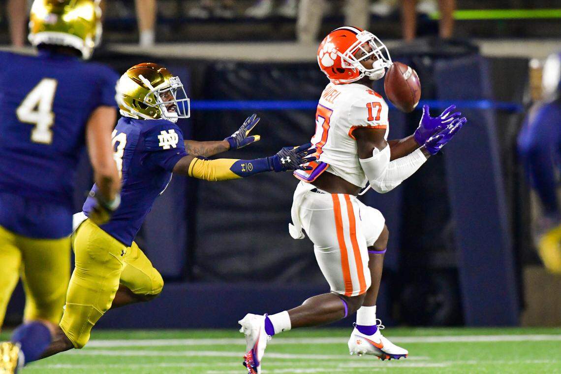 Clemson wide receiver Cornell Powell (17) catches a pass for a touchdown as Notre Dame cornerback TaRiq Bracy (28) defends during the first quarter of an NCAA college football game Saturday, Nov. 7, 2020, in South Bend, Ind. (Matt Cashore/Pool Photo via AP)